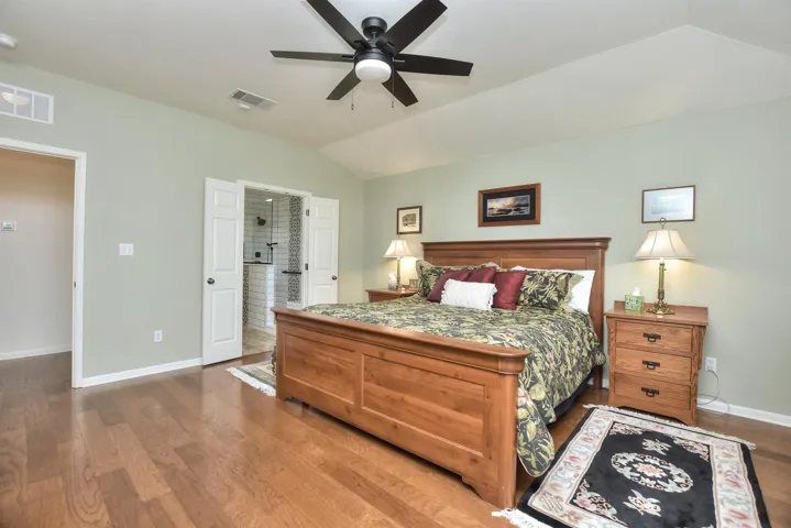 Another view of the Primary Suite shows you French doors leaving to the bathroom.  Seriously, everything is this home is immaculate...