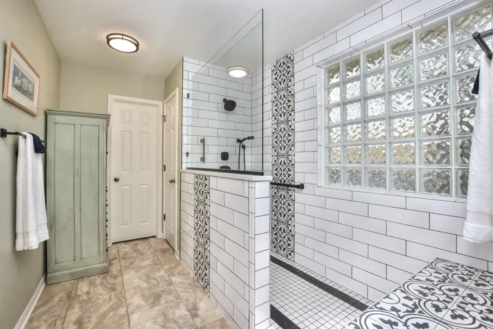 Walk into your large shower and enjoy a shower head on the wall as well as a hand held shower head.