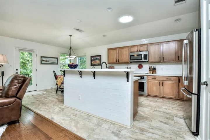Add a couple of stools to your breakfast bar & visit with the chef while they are cooking.  This part of the breakfast bar is lined with white subway tile..
