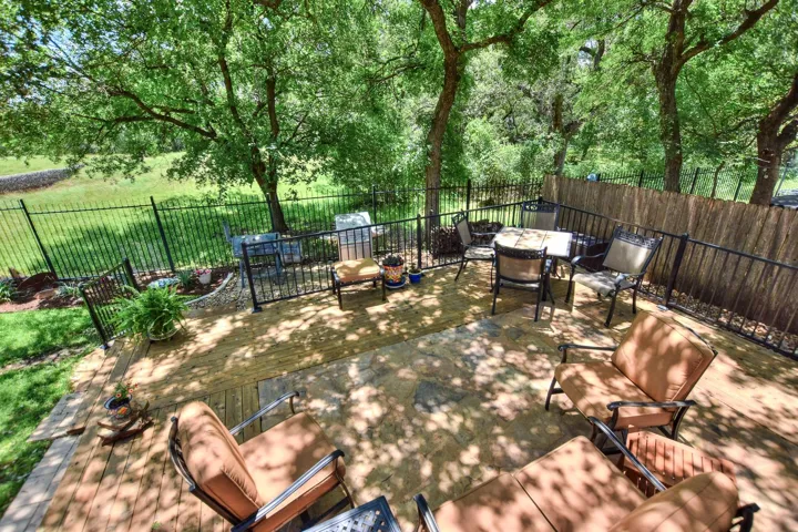 Oh my gosh...this backyard is like paradise.  Enjoy the shade from the trees and listen to the abundance of birds...