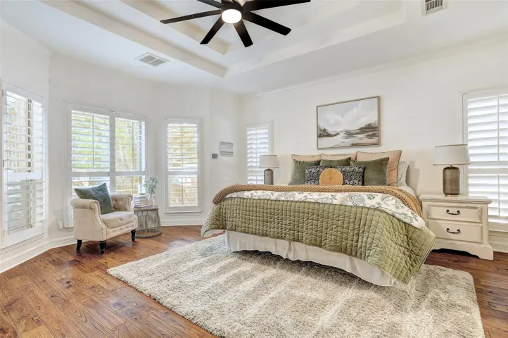 Primary Bedroom overlooking backyard and pool area
