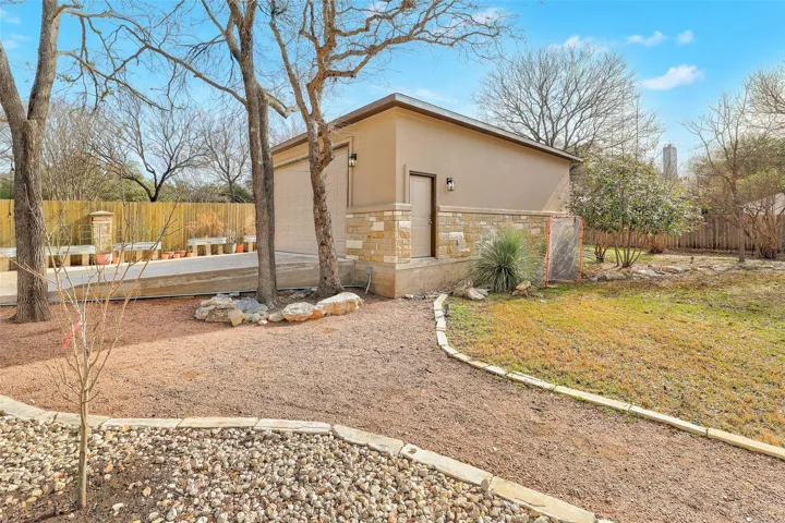 View of outbuilding with a garage
