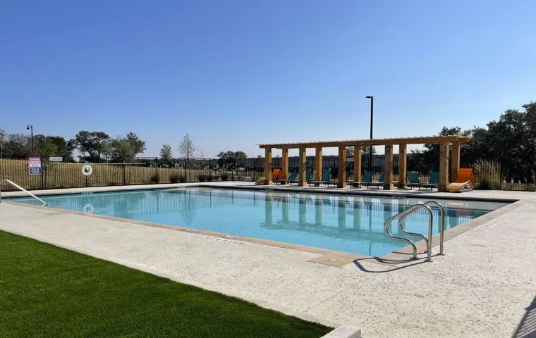 Community pool featuring a patio and a pergola