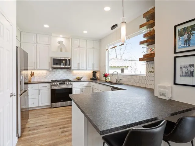 Kitchen featuring open shelves