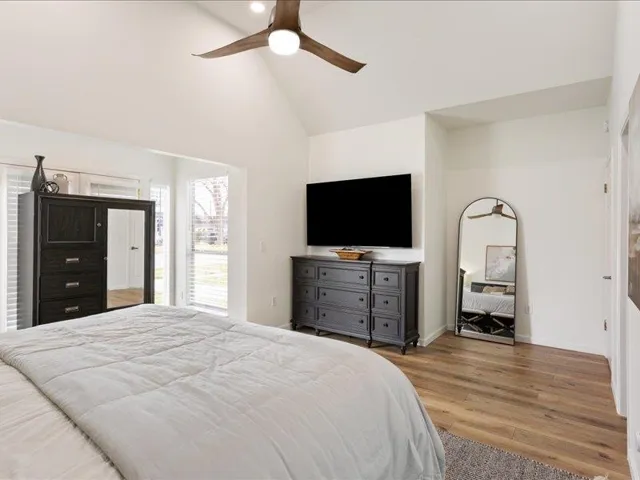Primary Bedroom featuring vaulted ceilings