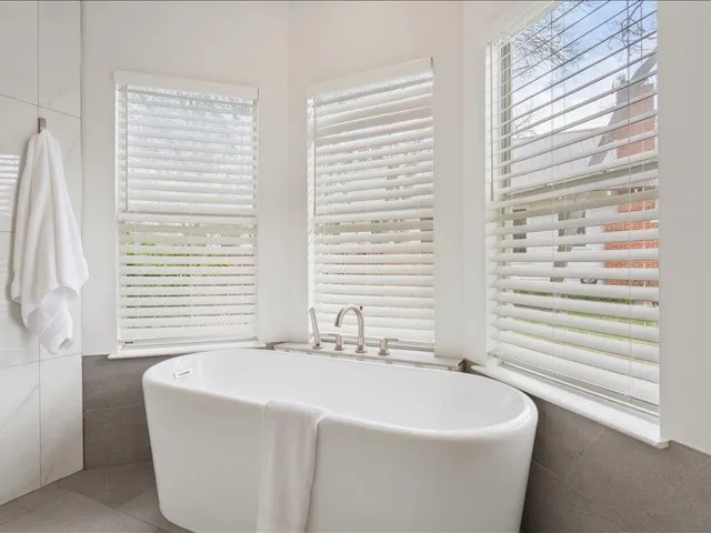 Primary bathroom featuring a freestanding tub