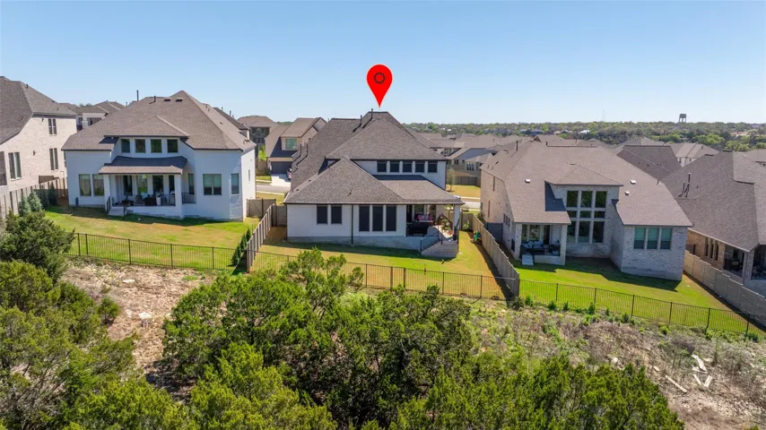 Nice aerial view of the lot and greenbelt view; less than one mile from walking trail; seller added back gate easy access to nature