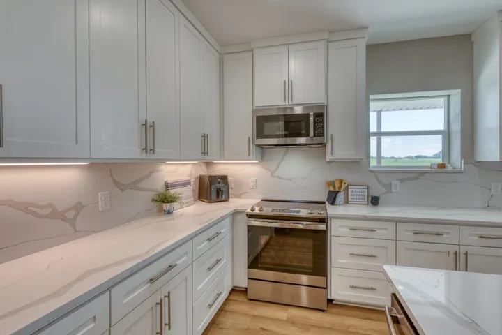 Beautiful Quartz counter tops; under cabinet lighting; custom cabinets