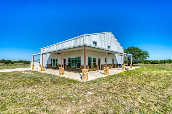 This property is truly move in ready; Bring your RV; Bring your Boat, ATVs, tractor or trailers; Over 2400 sq ft of garage/shop space; 4 exterior doors to the shop