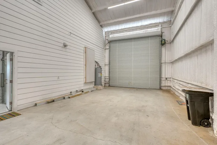 Some say barn some say shop;  for convenience, this barndominium offers multiple exterior doors (4)