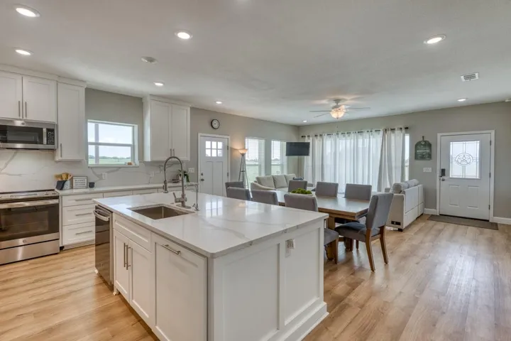 Large spacious Quartz island; custom cabinets; stainless appliances