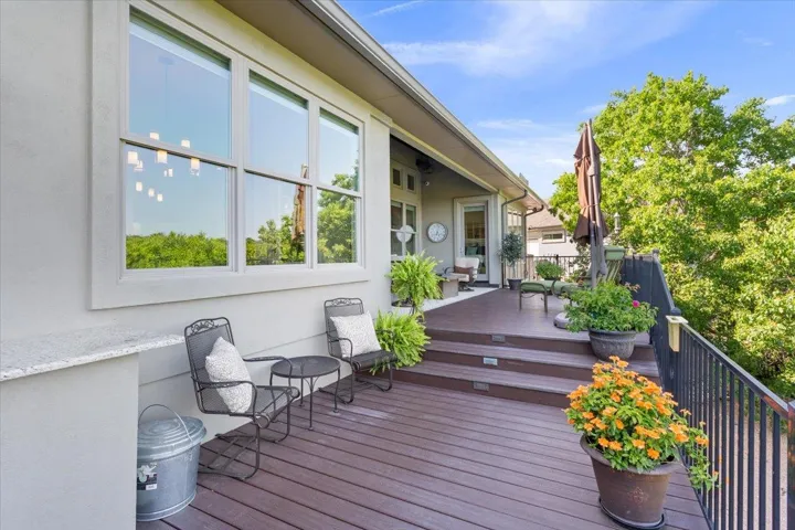 There are 3 levels of decks on the rear of this home...with just a few steps.  The higher one here shows you the first one and then it steps down to the second deck...