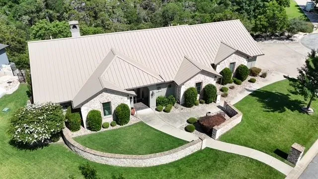 Aerial view of property and partial view of surrounding area