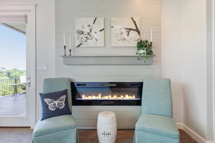 This gas log fireplace is in the primarysuite...relaxation & ambiance...that's the mood.  To the left of the fireplace is a private entrance to the first deck....Relax.  This is your sanctuary!