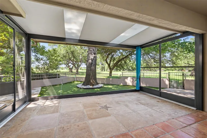 An enclosed patio offers a private putting green with golf course views.