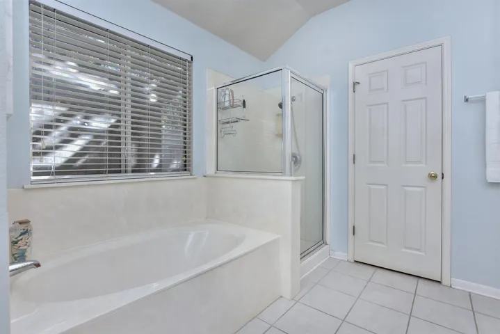 View of garden tub and separate shower