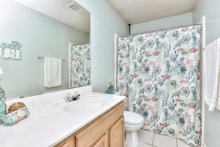 This secondary bathroom sits between 2 secondary bedrooms.