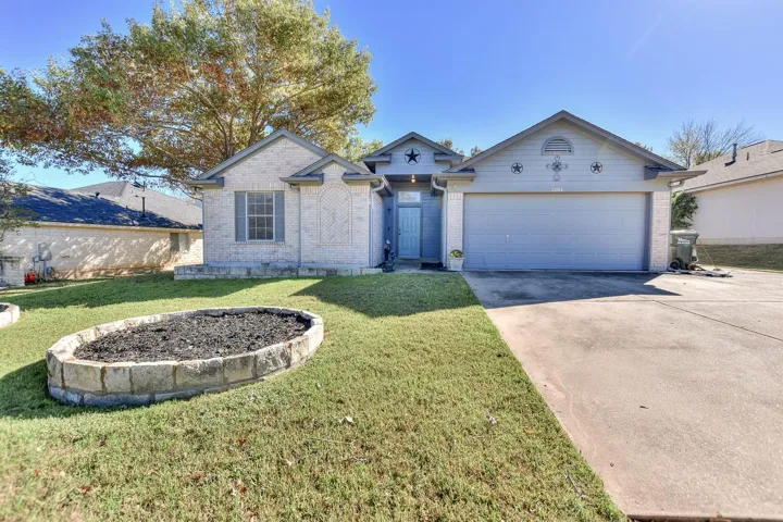 1 story charmer with 4 bedrooms, 2 baths, 2 dining areas and 2 car garage