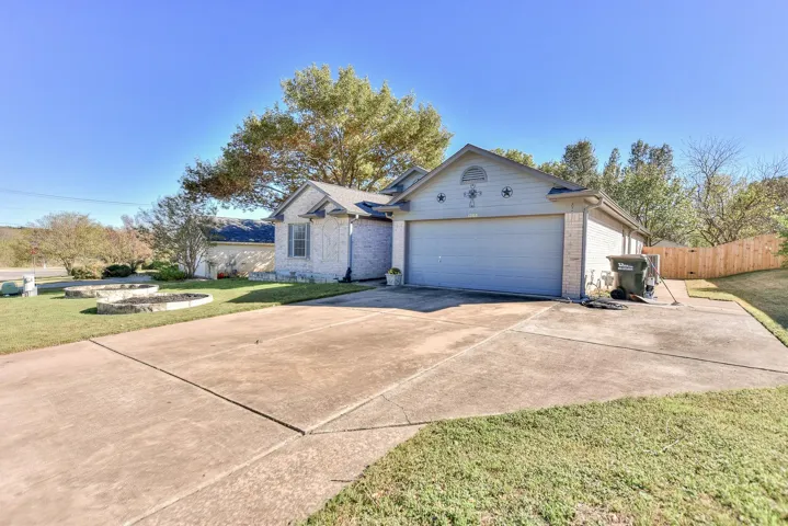 Note the extra driveway space and fresh fence on the right side of the property!