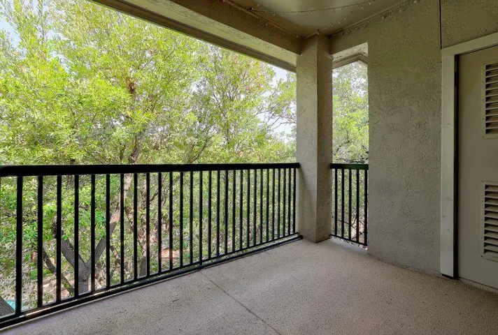 Enjoy tranquil moments and leafy green views from this private balcony, perfect for morning coffee.
