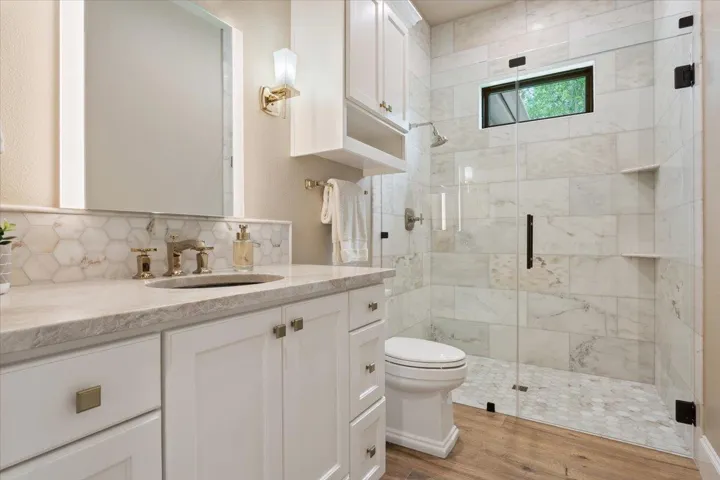 Full Bathroom directly outside of Bedroom #2...across from the closets for Bedroom #2 in the hallway...