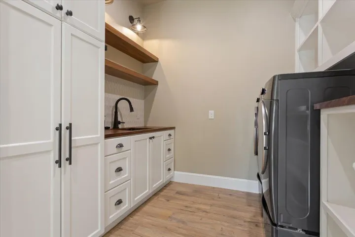 Once again, the Sellers thought of everything. On the right, washer & dryer hookups & cubby shelves galore...
