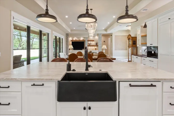 All Plumbing Fixtures are Koehler oil rubbed bronze.  The Blanco brand farm sink is from the Silgranit Sink Collection. Fully integrated Miele Dishwasher with Custom Panel is just to the right of the sink...