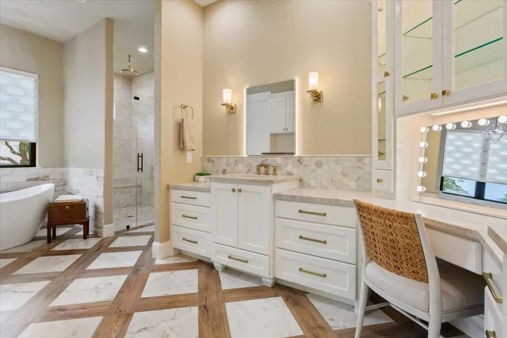 A distant view of the walk-in shower and freestanding soaking tub....