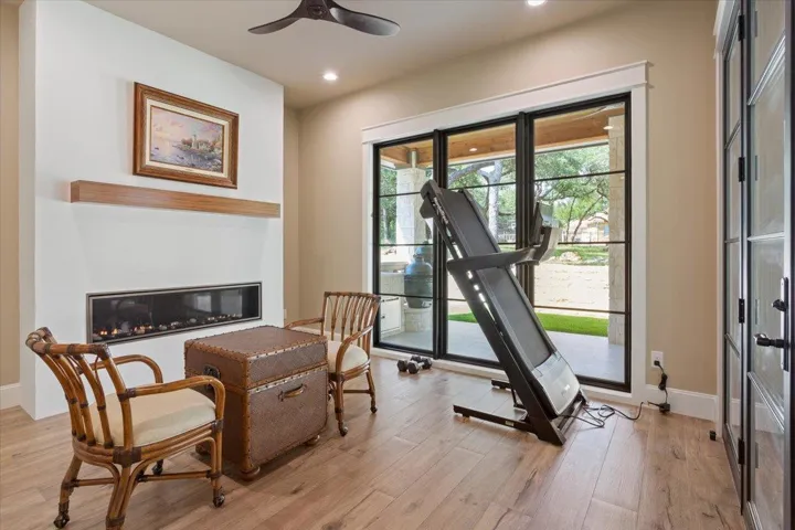 This is the any & everything room again...Could also be used for a breakfast area or exercise room.  Electric built in fireplace with Walnut mantle...