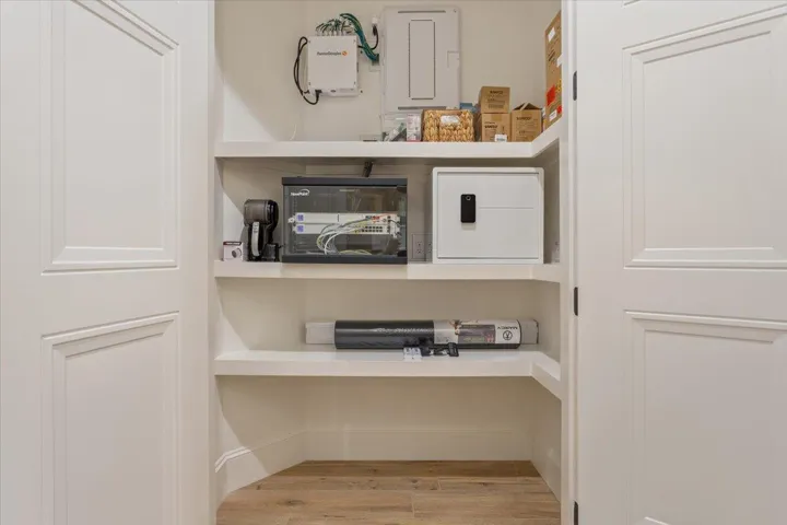 One of the 3 spacious closets in between the Primary Bedroom & 2nd Bedroom contains the home's computer equipment.  This equipment stays with the home.