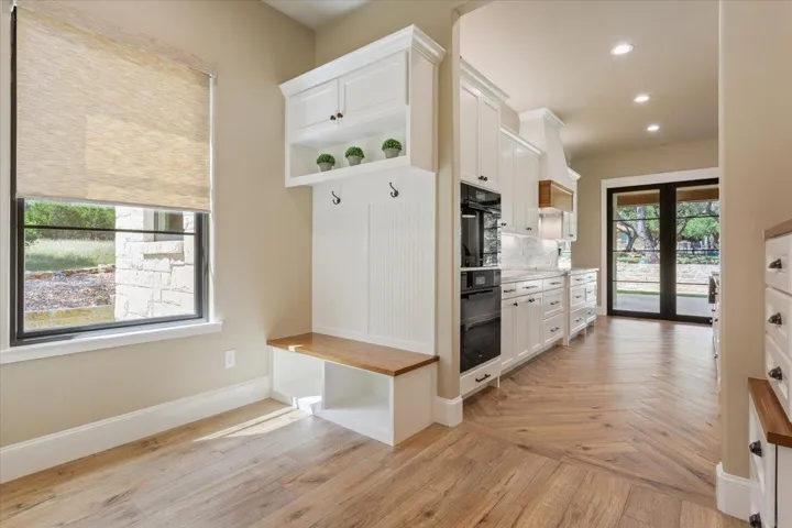 Just before the kitchen is a great Mud Room area for your shoes and raincoats...