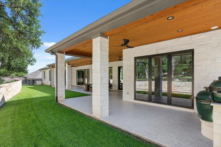 Step out of the "den" to your two Egg Grills in the built-in outdoor kitchen.  There is also a sink in this built-in outdoor kitchen.