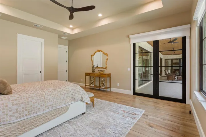 Double doorway to the covered patio.  Use your remote to end your day and put the shades down when you are ready to sleep...