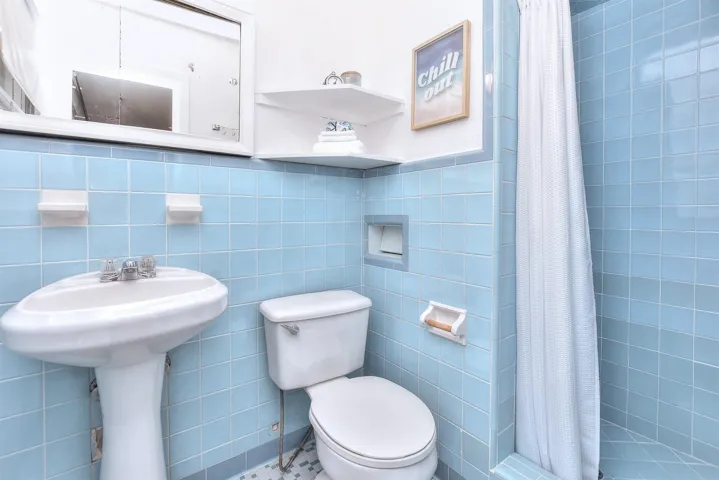 Original vintage charm with walk-in shower in the primary bathroom