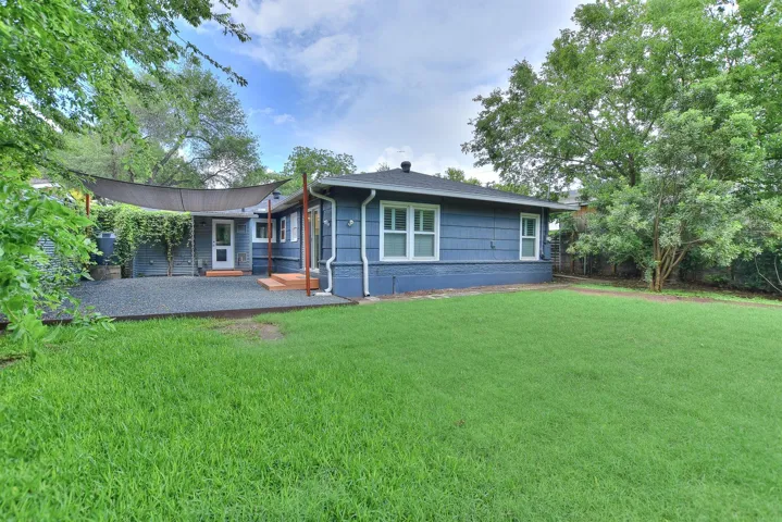 This home offers established lush landscaping and trees but leaves plenty of room to create your own personal spaces!