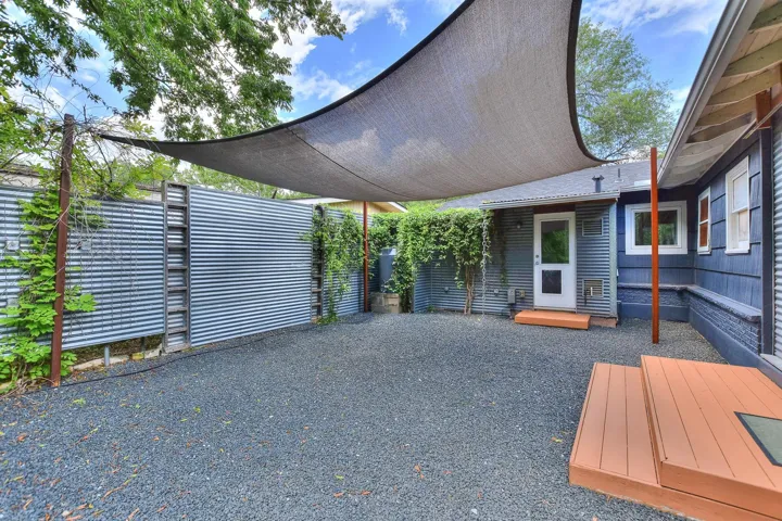 Another view of this inviting, private courtyard area with sailcloth cover that provides shade!