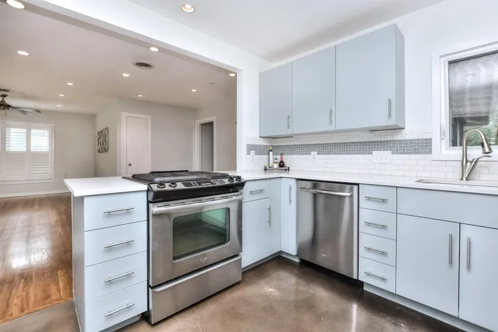 Stainless appliances include the gas range, dishwasher and refrigerator.