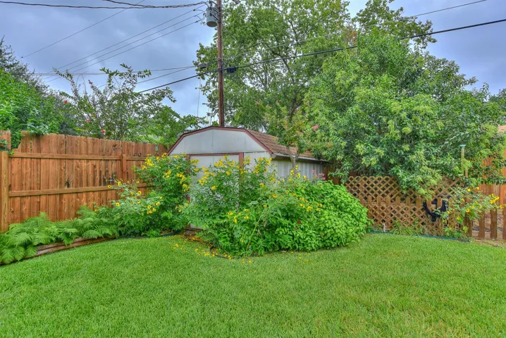 Tucked back in the left corner of the back yard is a nice sized storage shed!