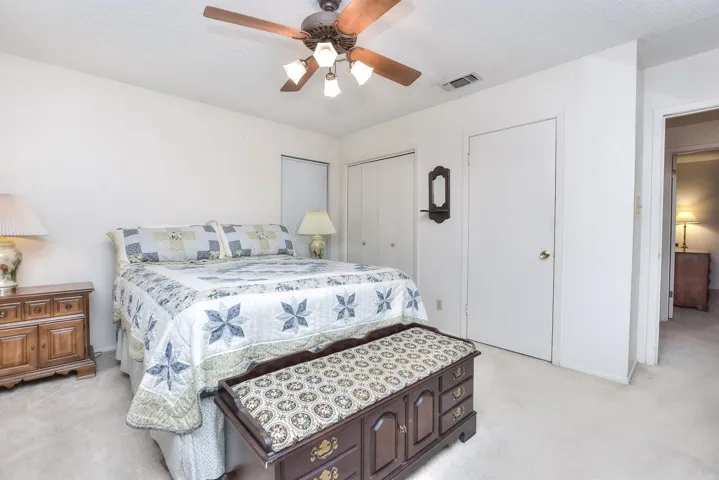 The primary bedroom offers 2 closets and an exterior door that opens to the patio...easy to let your pets out at night.