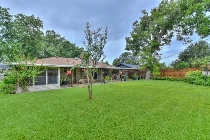 You can see the workshop tucked away on the left side of the back patio in this picture.