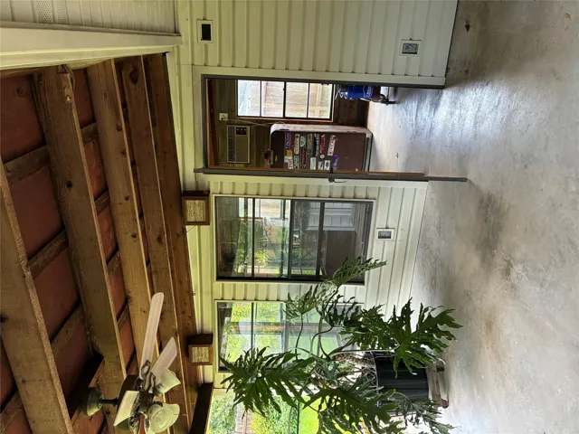Nice workshop area sits on the end of the patio complete with window A/C and windows when the weather is cooler.
