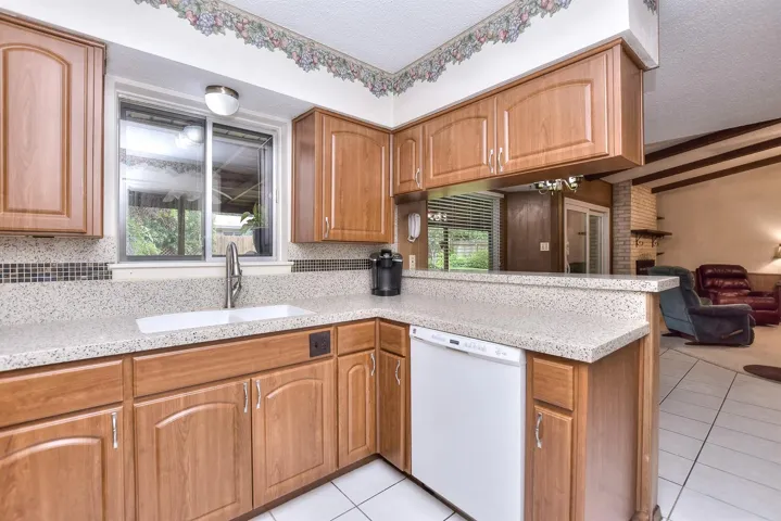 Note the big window at the kitchen sink....it opens to offer a pass-through to the patio for convenience when grilling or entertaining!