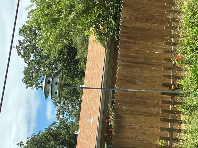 Purple Martin birdhouse welcomes back "tenants" every year!