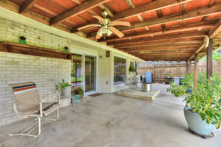The oversized, extended covered patio offers multiple seating and entertaining areas!