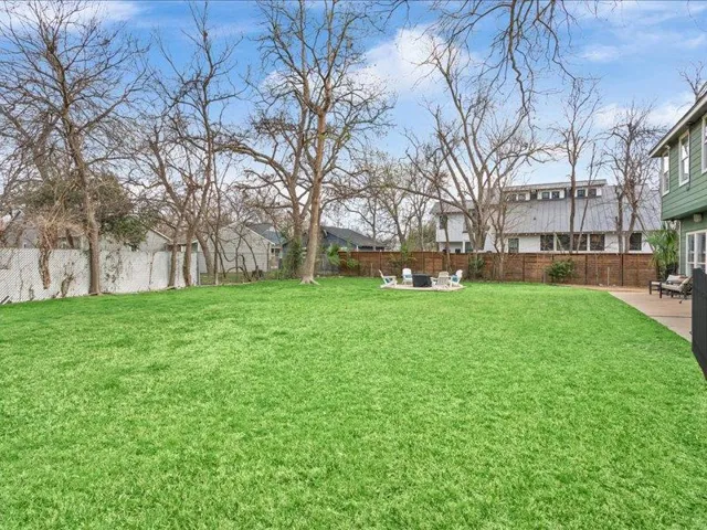 An expansive backyard offers ample green space for leisure and outdoor entertaining.