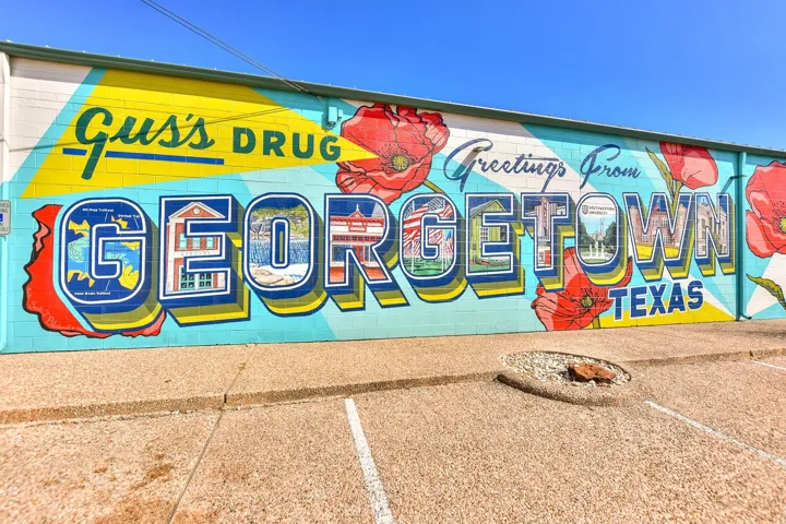 A vibrant mural graces the exterior of this commercial building, adding a unique charm.