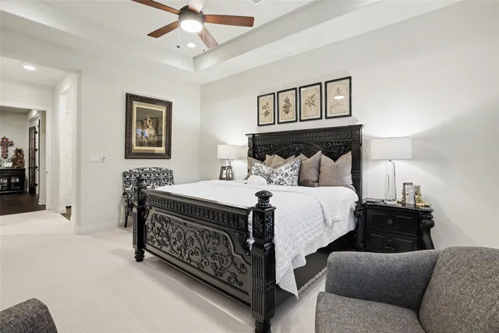 A tray ceiling pairs with soft carpeting in this elegant private suite.