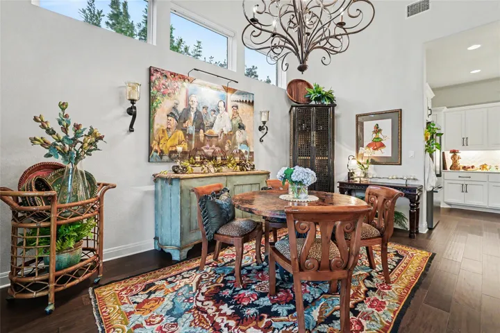High clerestory windows and rich wood flooring define this elegant dining space.