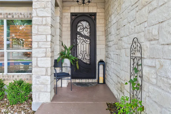 Frond door was replaced with a metal door with muted glass insert and wrought iron design...Front window replace with larger paned glass instead of small panes...