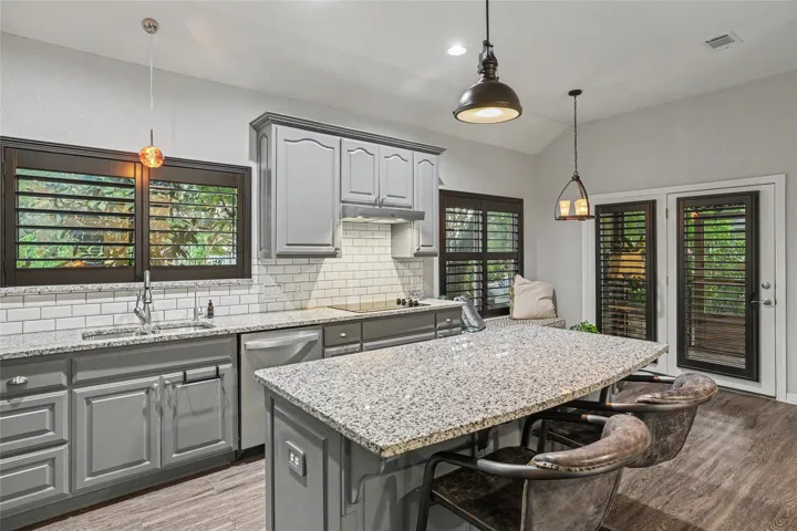 A different view of the kitchen shows how your guests can gather here while you are serving...